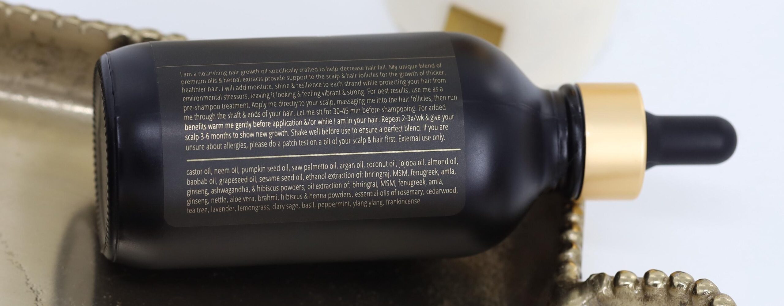 Ingredients are visible on a Luscious Locks bottle.