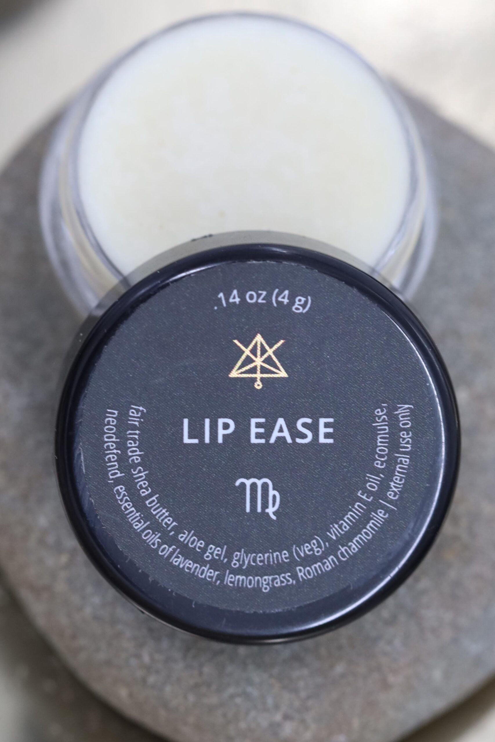 An open jar of Lip Ease.