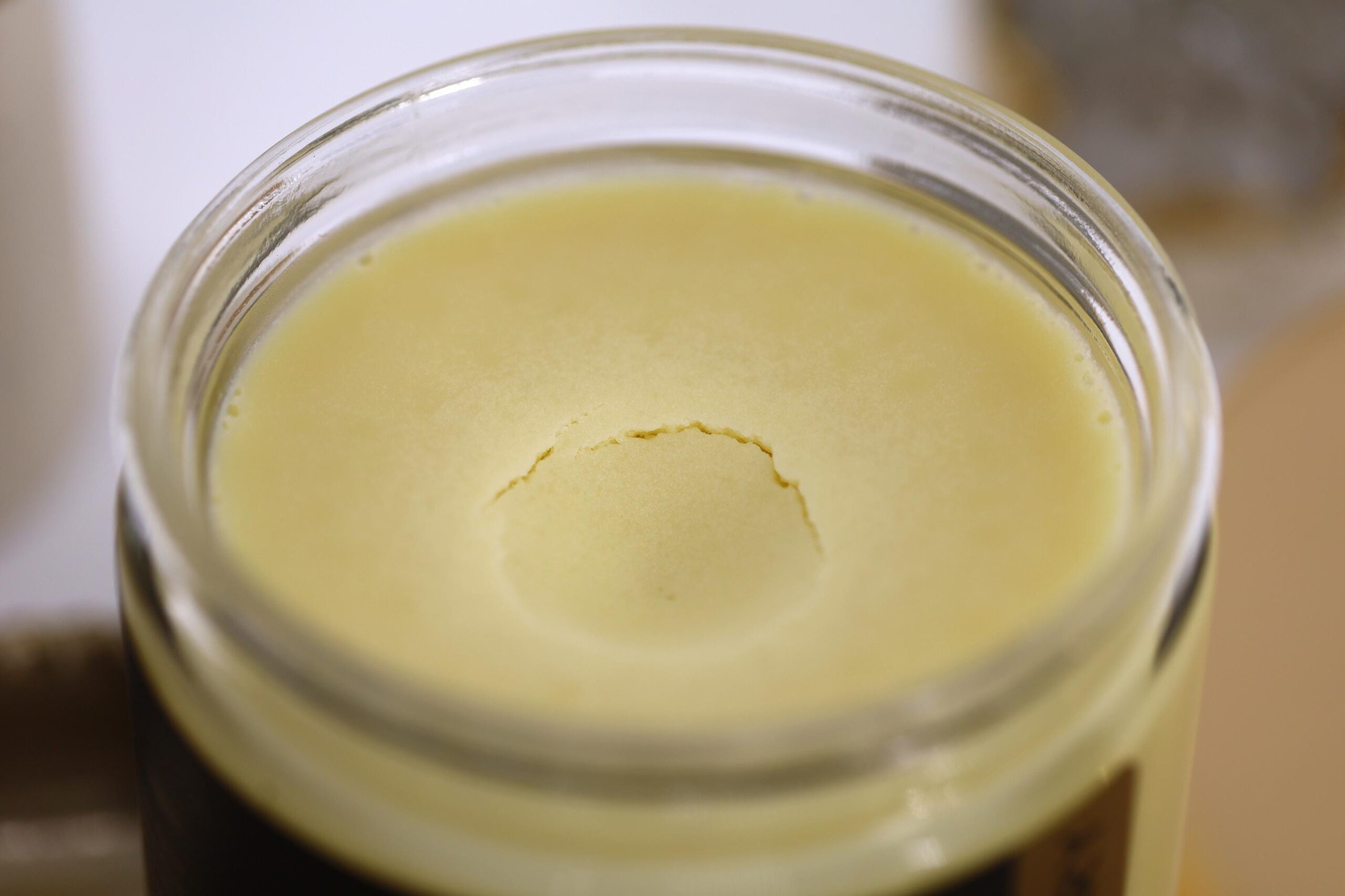 An open jar of Hydrating Body Butter