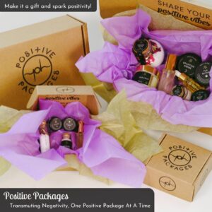 Four beautiful gift packages of various AK Apothekary products inside them wrapped in gold and covered in lavender paper.